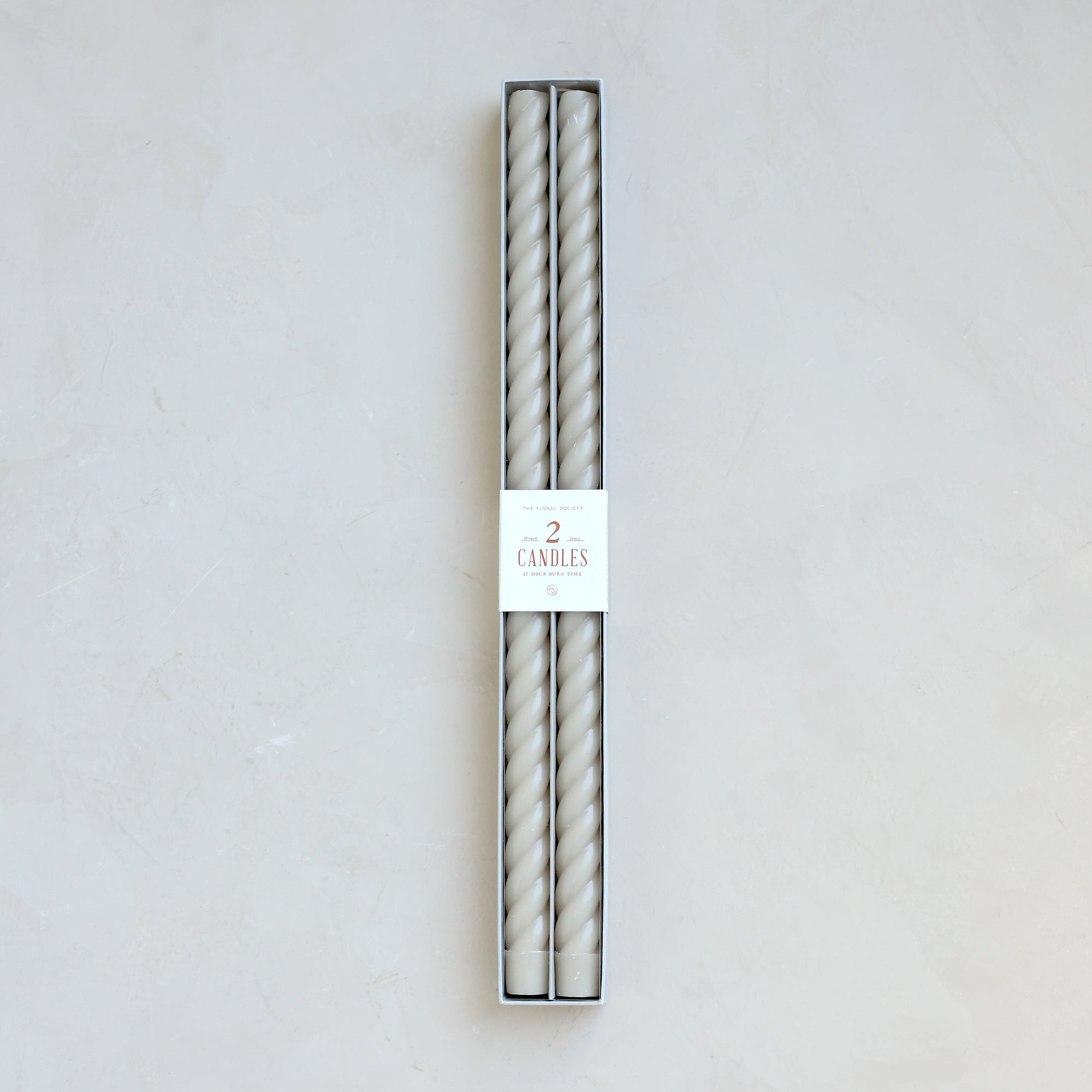 color_option-parchmentOur Fancy Taper Candles are hand-molded and embody a superior depth of color. A cotton wick is used for the cleanest burn, and the base is sized to fit a standard holder. Each 18” candle is crafted to burn for eighteen hours. Subtle variations in wax depth and color opacity may occur.  Two 18” candles per pack. Standard 7/8” base. Made of high grade paraffin wax. Parchment braided tapers