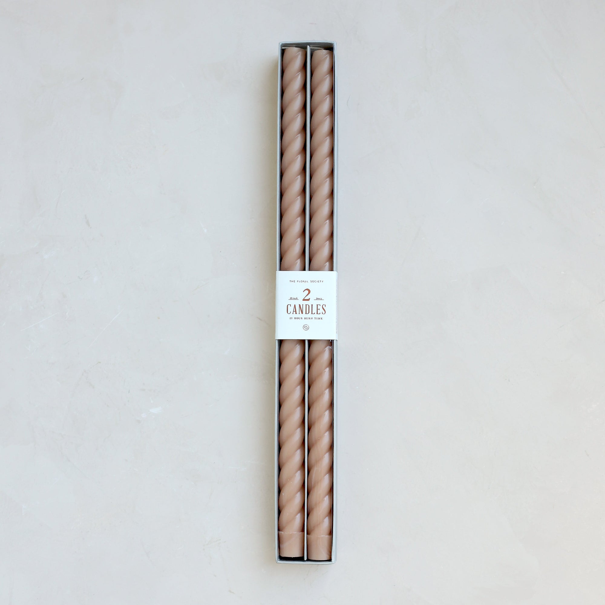 Our Fancy Taper Candles are hand-molded and embody a superior depth of color. A cotton wick is used for the cleanest burn, and the base is sized to fit a standard holder. Each 18” candle is crafted to burn for eighteen hours. Subtle variations in wax depth and color opacity may occur.  Two 18” candles per pack. Standard 7/8” base. Made of high grade paraffin wax. Petal taper braided