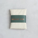 Our pure cotton, cross-back apron is both stylish and utilitarian, and designed to fit all body types. Featuring wide front pockets, it is ideal for working in the garden, kitchen, or studio. Each apron is soft-washed for added comfort. Azo-free dye.  Pure Cotton and hand sewn. Machine washable. One size fits most.