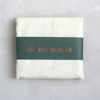 Our half-wall organizer features 20 durable compartments in a variety of sizes to accommodate a multitude of supplies. Made of heavy-gauge cotton canvas with copper rivets, this versatile design will look great while tidying your workshop, kitchen, closet, or playroom.