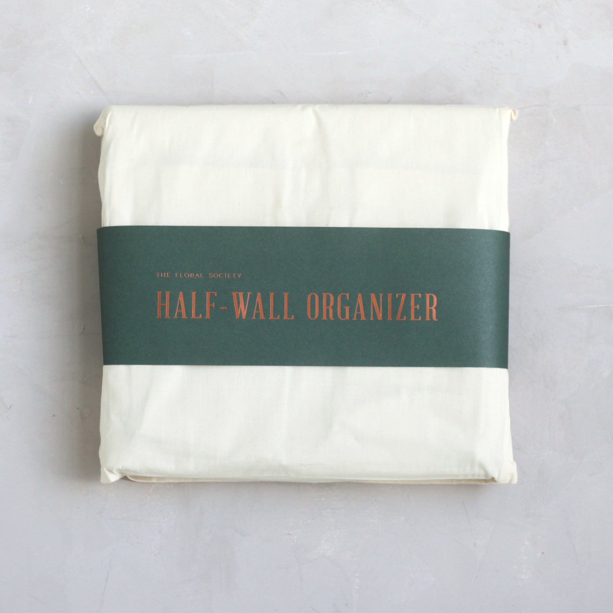 Our half-wall organizer features 20 durable compartments in a variety of sizes to accommodate a multitude of supplies. Made of heavy-gauge cotton canvas with copper rivets, this versatile design will look great while tidying your workshop, kitchen, closet, or playroom.