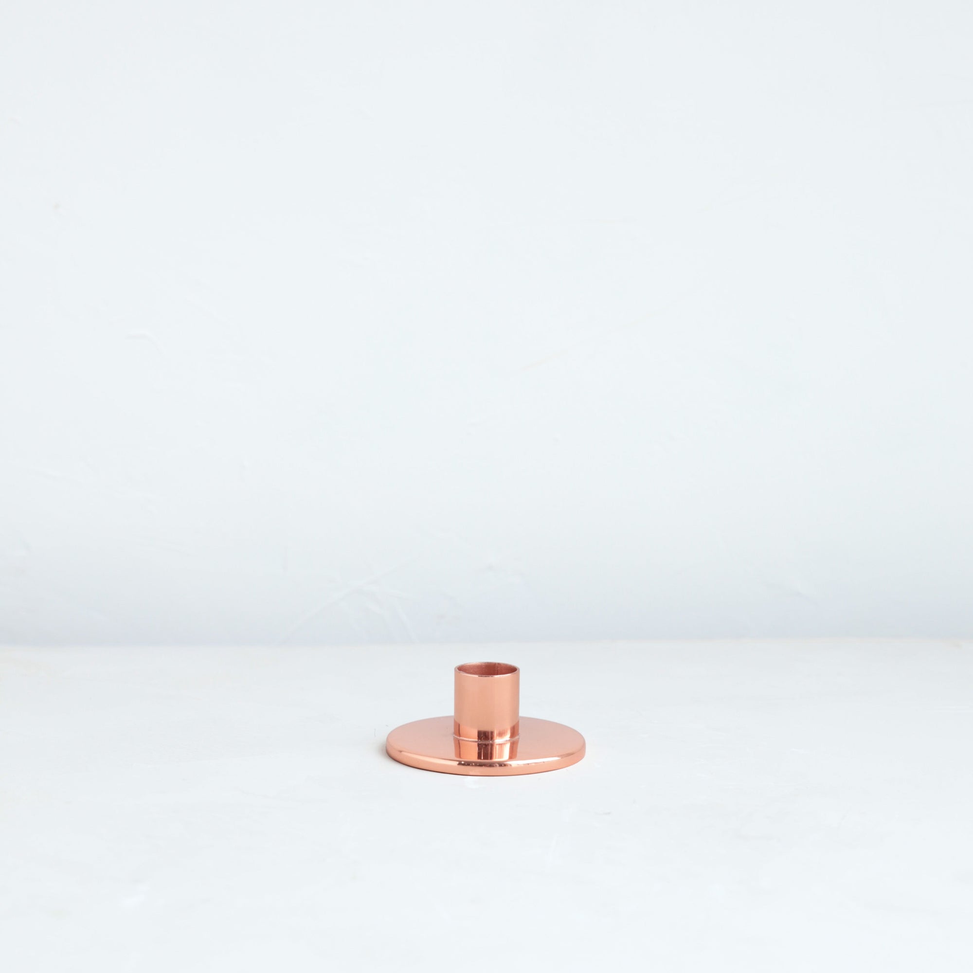 The perfect companion to our taper candle collection, our copper taper holders are a sleek, modern way to add a lustrous accent to any space. Each copper plated holder is sized to fit a standard taper candle.