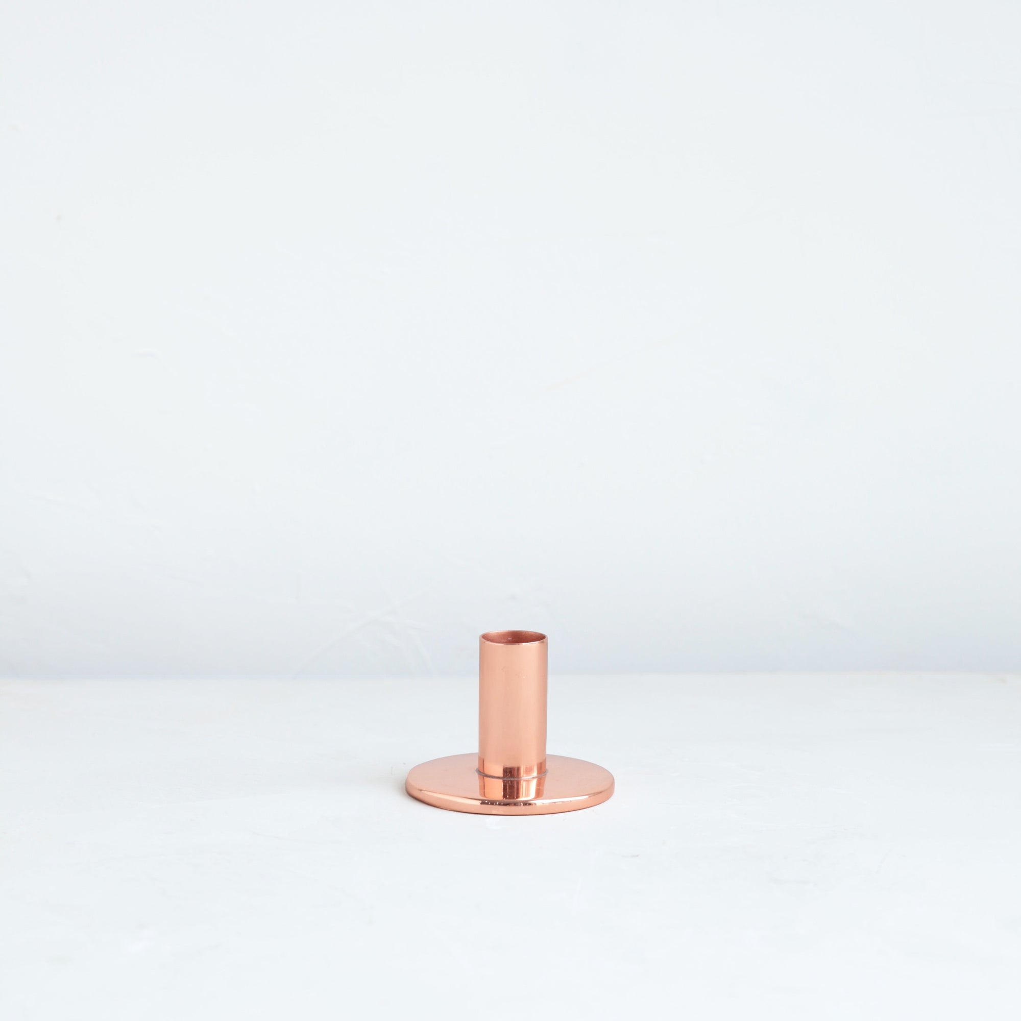 The perfect companion to our taper candle collection, our copper taper holders are a sleek, modern way to add a lustrous accent to any space. Each copper plated holder is sized to fit a standard taper candle.