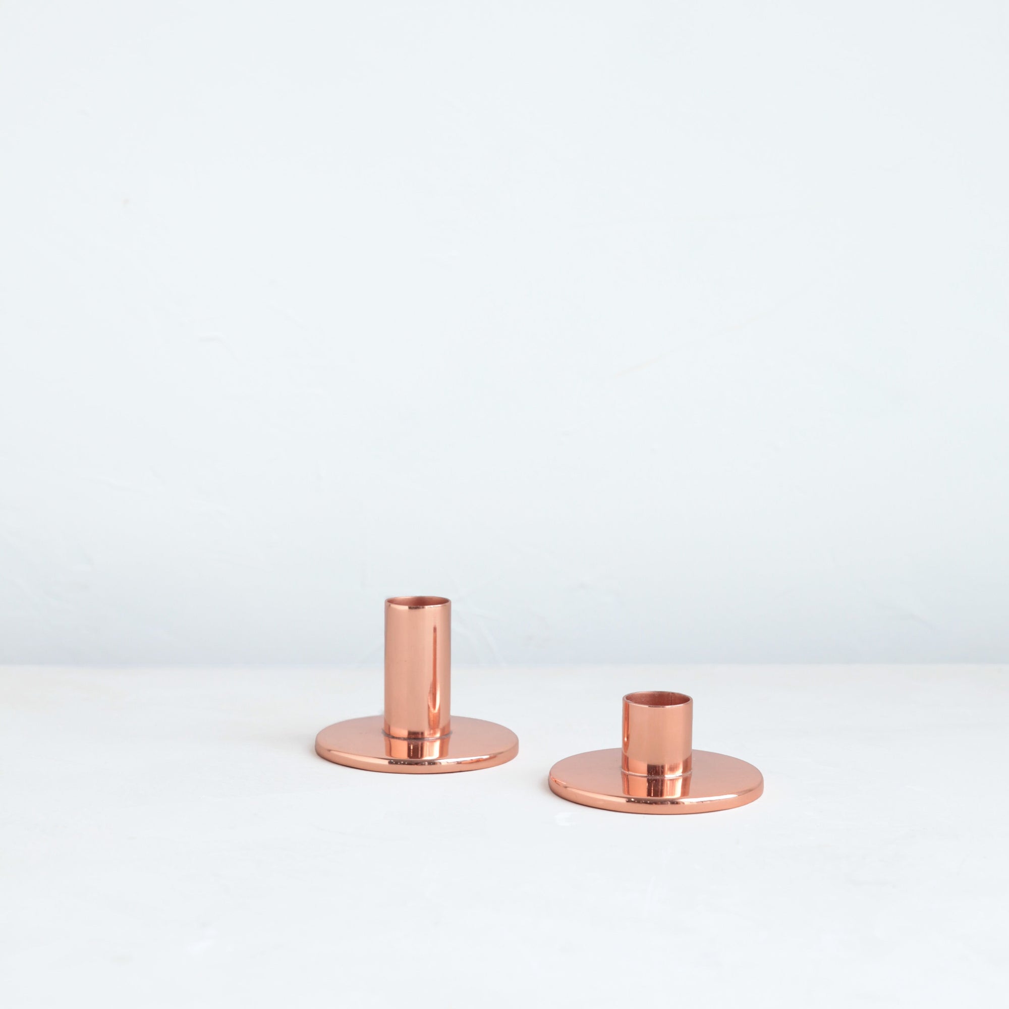 The perfect companion to our taper candle collection, our copper taper holders are a sleek, modern way to add a lustrous accent to any space. Each copper plated holder is sized to fit a standard taper candle.