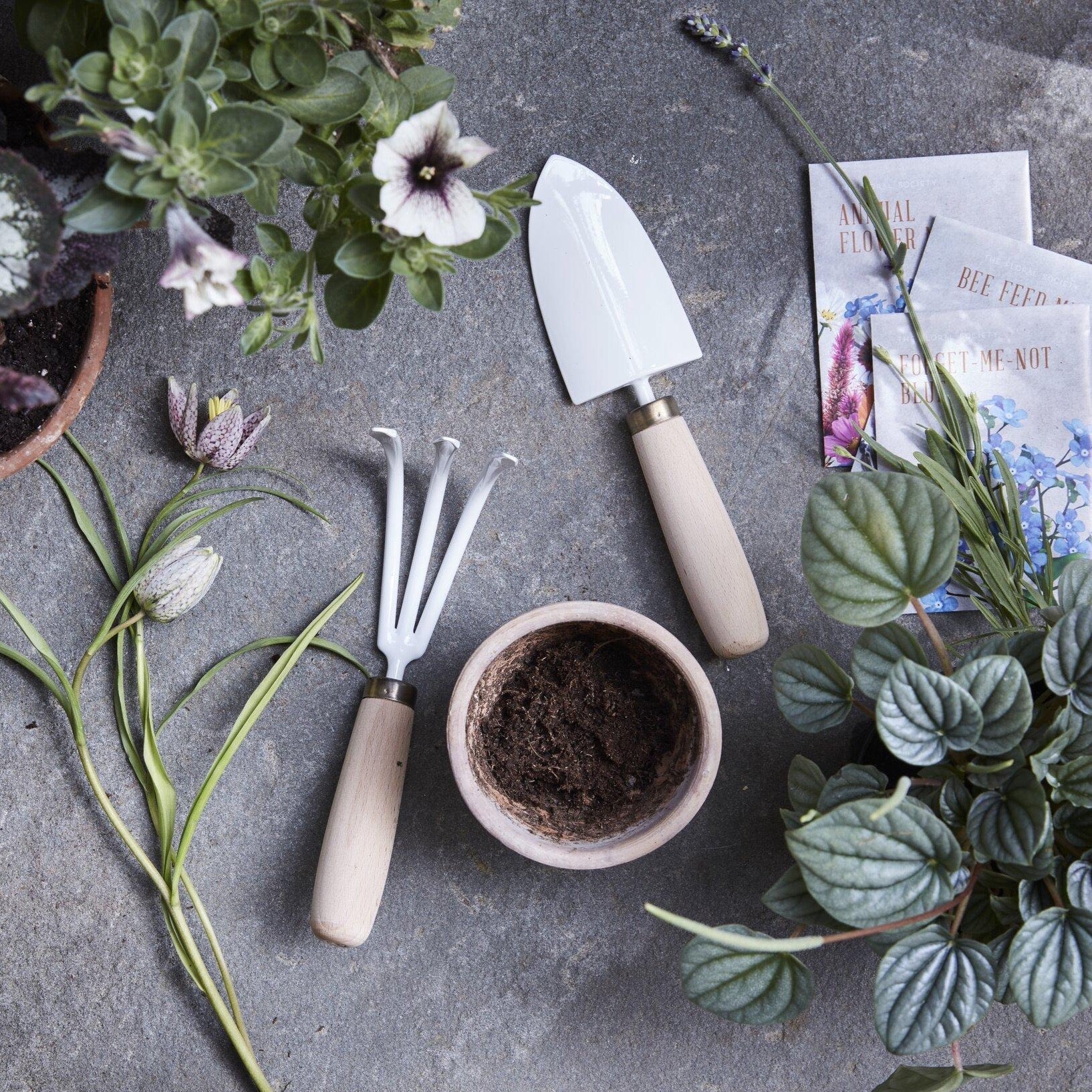 The palm-sized garden trowel and cultivator are a durable duo perfect for tending to an apartment garden, houseplants, and planting and transplanting seedlings. A great size for little green thumbs too. Both tools are hand-crafted, using Japanese sustainable beech wood for the handles and Japanese stainless steel blacksmith heat treatments and techniques. 