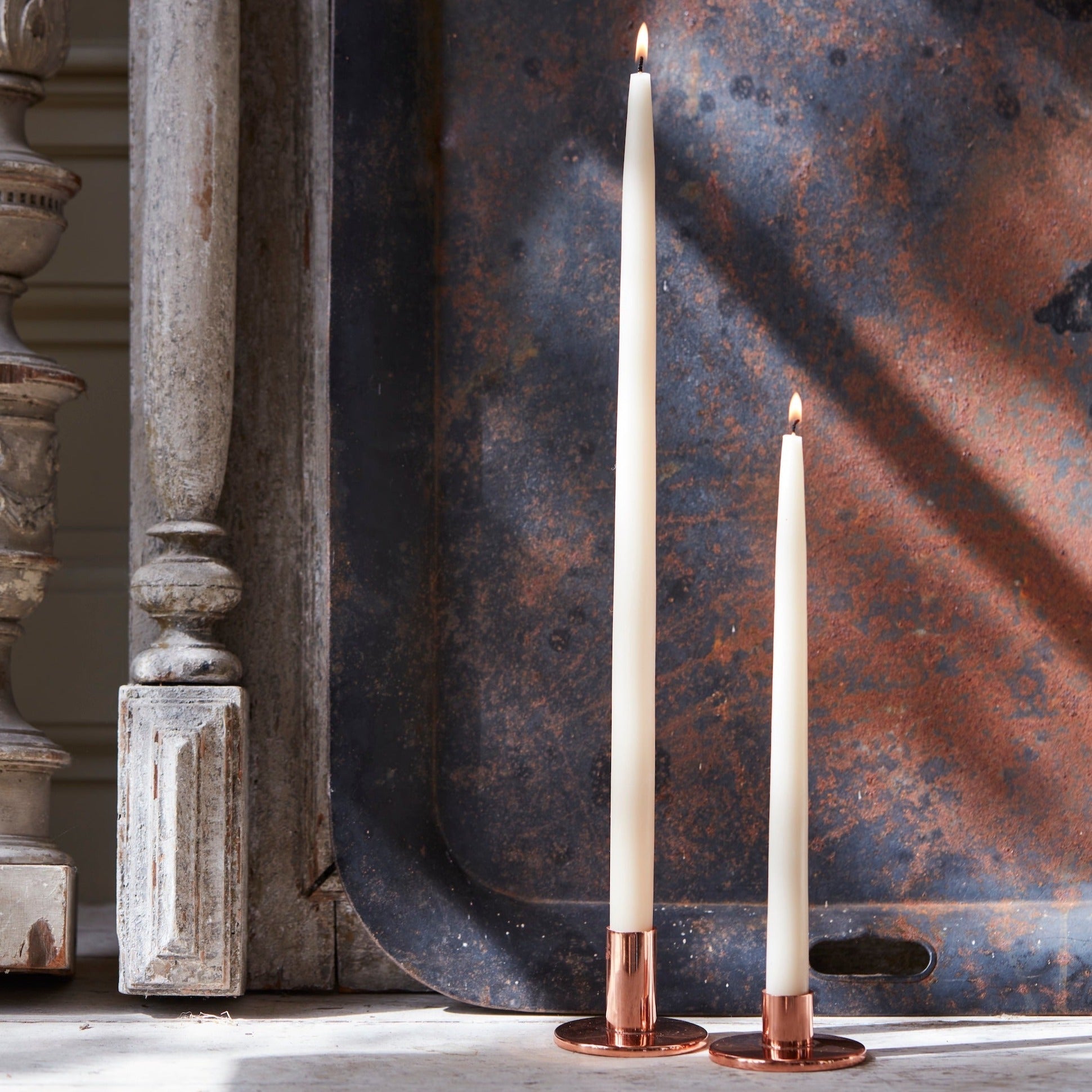 The perfect companion to our taper candle collection, our copper taper holders are a sleek, modern way to add a lustrous accent to any space. Each copper plated holder is sized to fit a standard taper candle.