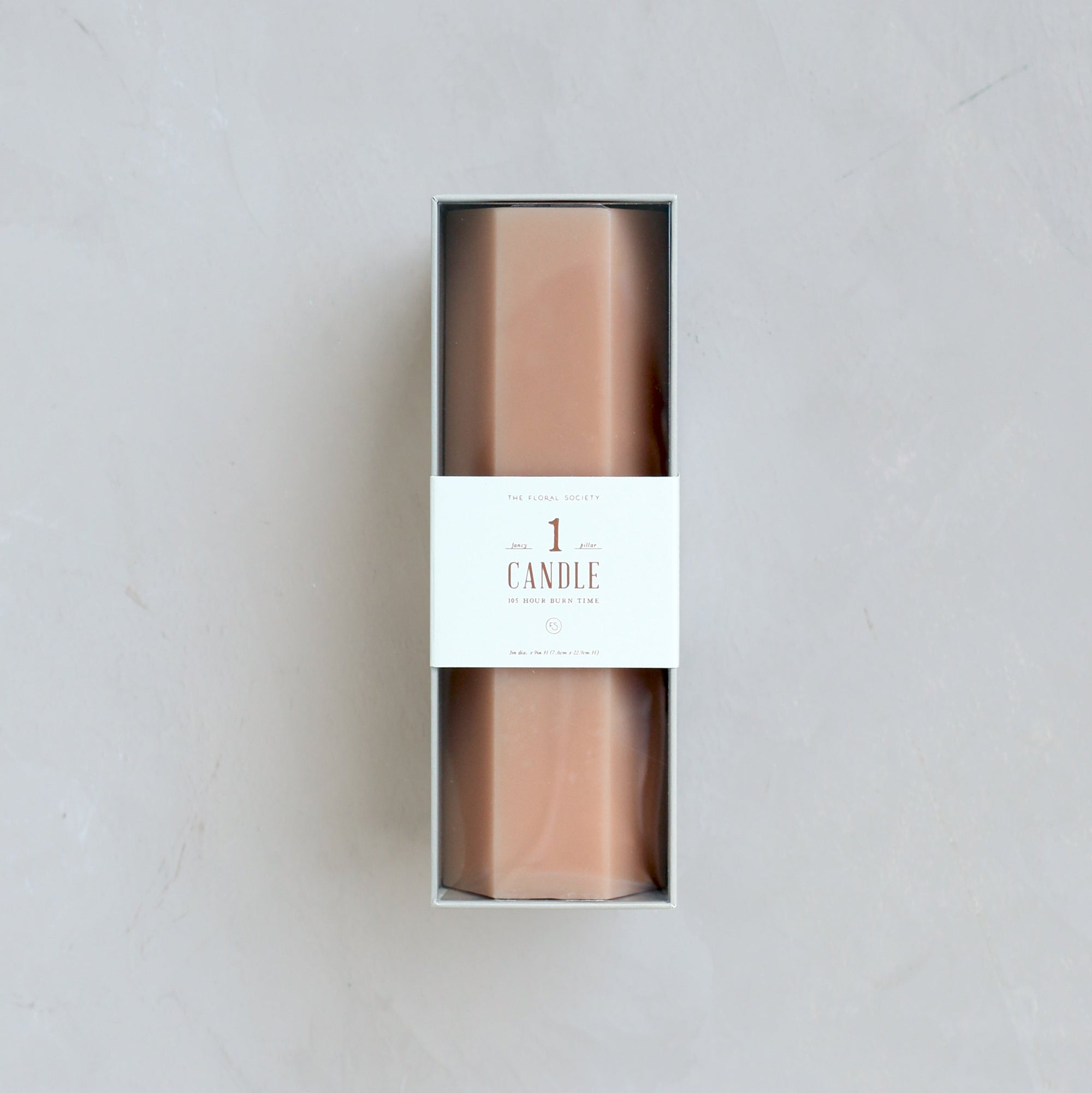 Our hexagonal pillar is a modern take on a traditional candle and embodies a superior depth of color, a cotton wick, and a 105-hour burn time. Subtle variations in wax depth and color opacity may occur. Available in 4 custom colors: Parchment, Moss, Petal & Clay.  Dimensions: 3”W x 9”H