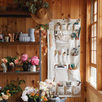 Our wall organizer features 23 durable compartments in a variety of sizes to accommodate a multitude of supplies. Made of heavy-gauge cotton canvas with copper rivets, this versatile design will look great while tidying your workshop, kitchen, closet, or playroom.